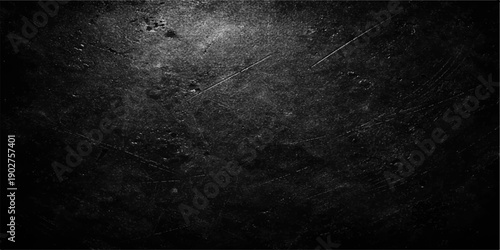 Dark grunge film background featuring a scratched black concrete wall texture with vintage gray stone patterns and a dirty rough cement surface backdrop