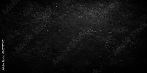 Aged dark grunge background featuring a textured black and white vintage stone wall with a rough dirty concrete surface and gray paper pattern for a blank weathered backdrop design