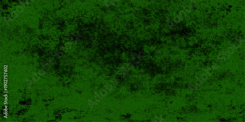 A dark aged green grunge background with a textured vintage paper surface featuring rough brown rust patterns and dirty paint splatters on an antique grungy wall backdrop