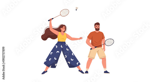 Young couple playing badminton together outdoors in casual wear smiling and having fun with rackets and shuttlecock