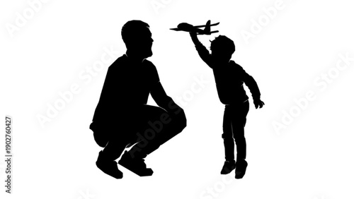Father watching son playing with toy airplane silhouette