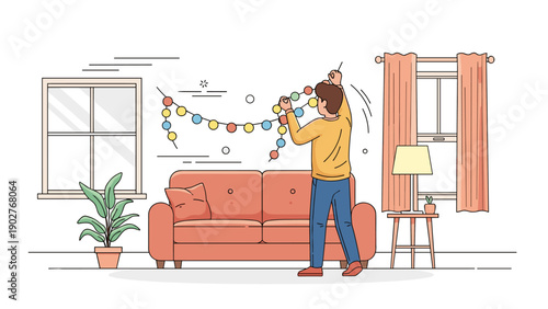 Young caucasian male decorating living room with festive string lights