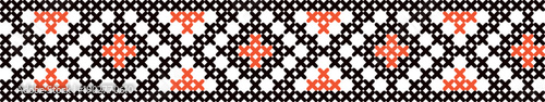 A black and white striped pattern with red and orange dots