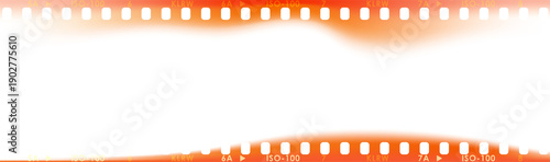 Fényképezés Panoramic 35mm film frame with warm orange light leaks