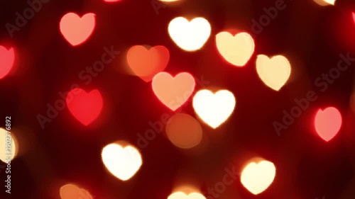 Romantic hearts and red bokeh lights on deep background for valentine’s day designs and love celebration themes. Video
