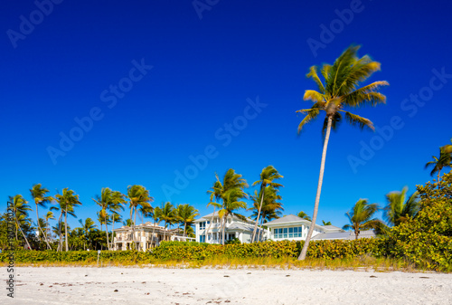 Beachfront homes on Naples Beach Florida. Long exposure art photo