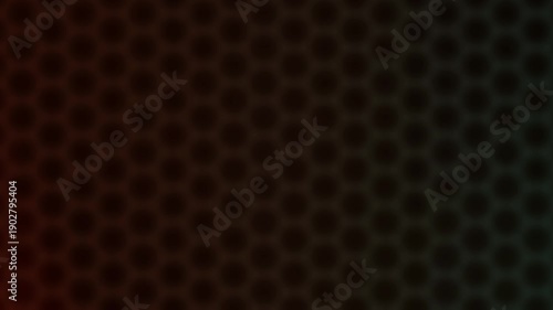 Dark abstract honeycomb pattern background with subtle color gradient illumination creating a seamless loop