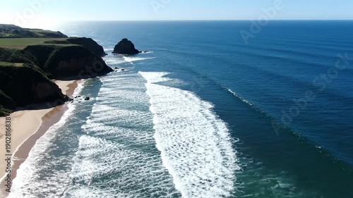 Aerial View of Rocky Coastline and Waves.