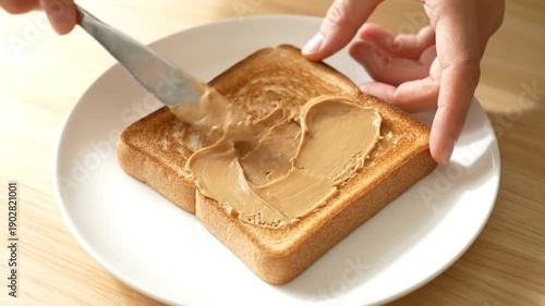 Spreading Peanut Butter on Toast.