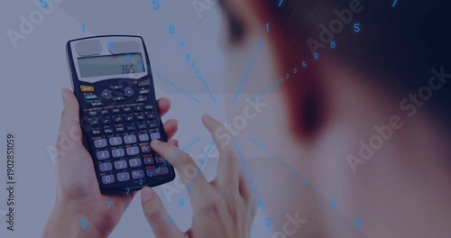 Female operator pressing calculator keys, causing blue data overlay and checking results for tech