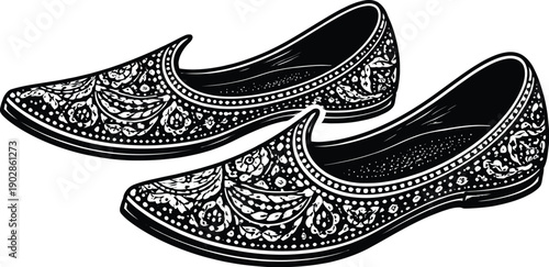 Intricately designed black and white illustration of traditional ornate Indian jutti footwear pair