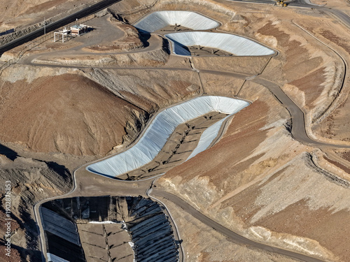 Фотография Aerial view of geosynthetic ponds with geonet geomembrane for landfill