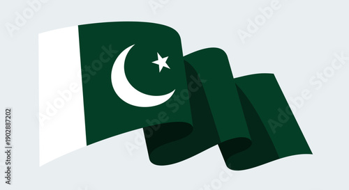 National flag of Pakistan waving in the wind, symbolizing freedom and independence with crescent moon and star