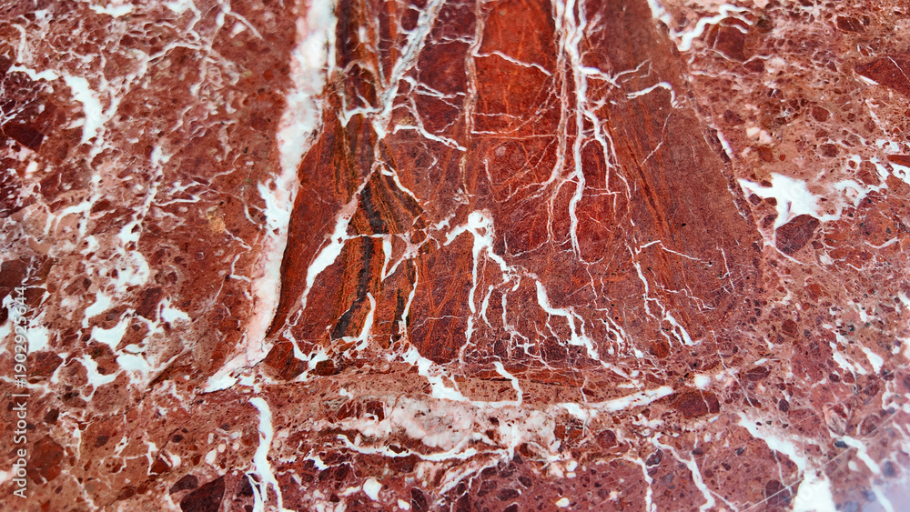 Fototapeta premium Close up of red marble with white patterns found in nature