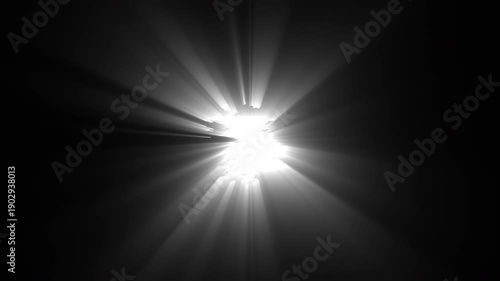 Bright light source with rays emanating against dark background. Suitable for dramatic mood, energy, power or abstract concepts. Vibrant and striking visuals.