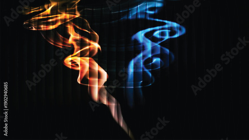 Abstract blue smoke glowing and flowing on a dark black background with energy and motion