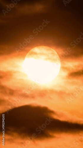 Scenic sunset time-lapse over natural landscape, revealing dawn colors and misty atmosphere.