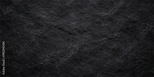 A dark textured surface featuring a macro blend of black leather and rough fabric material with an old grunge pattern suitable for a textile wallpaper background
