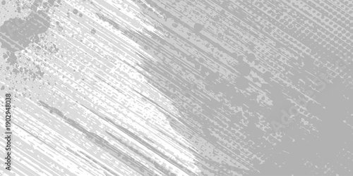 Abstract background with diagonal gray brush strokes and scattered dark particles on a white surface.