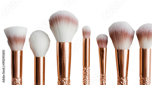 A set of luxurious makeup brushes with rose gold handles on transparent background