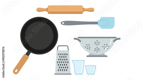 Kitchen utensils and cooking tools arranged on a clean white surface for baking and food preparation