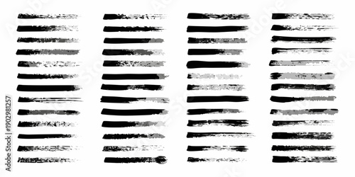 Abstract arrangement of black brush strokes on a white background