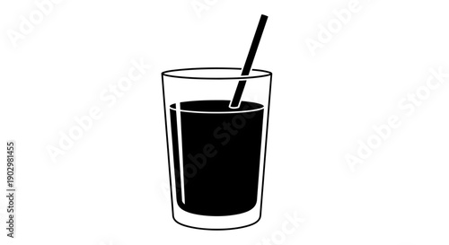 A glass of dark liquid with a straw is served indoors.
