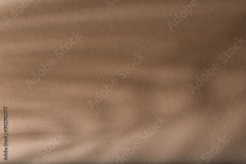 Striped shadows on brown ba...