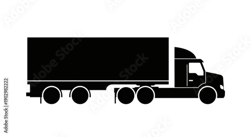 A large truck is driving on the highway with cargo in the daytime from a side view