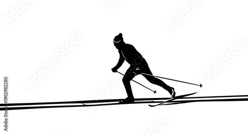 Silhouette of a skier in action on snow-covered slopes viewed from the side