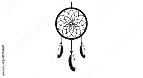 A dreamcatcher with feathers hanging from a webbed circle, isolated on a plain background, viewed from the front.