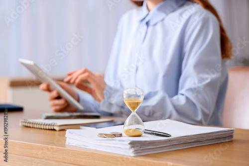 Businesswoman with hourglas...