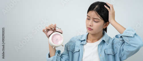 Fényképezés Shocked Asia young woman looking at clock alarm, lady is late appointment or wor
