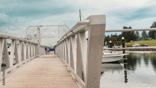 Wallpaper Mural Visitors explore pier, coastal streets, and observe waterbirds at Bermagui Fishermen's Wharf, NSW, Australia, September 26, 2022 Torontodigital.ca