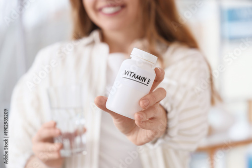 Young woman with vitamin B ...