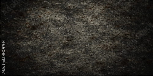 Aged dark grunge background with a rough vintage texture on an old stone wall surface featuring a black concrete pattern and blank copy space