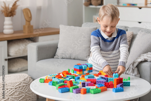 Happy cute little boy playi...