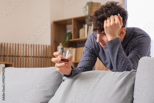 Drunk young man at home. Al...