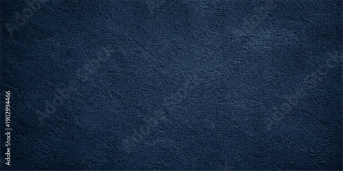A closeup of a dark blue leather texture background featuring a rough patterned surface for a fashion design wallpaper