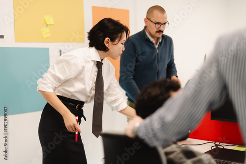 Business team collaborates in a modern office space with active discussions and planning on a project during a weekday meeting