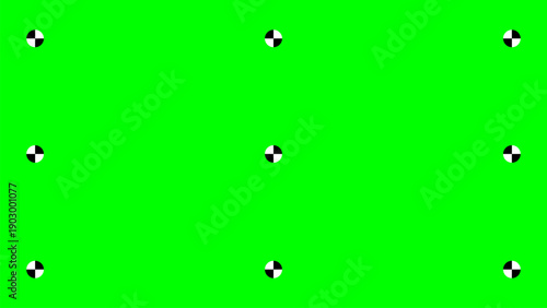 Green screen with tracking markers for motion graphics and visual effects production in the film industry