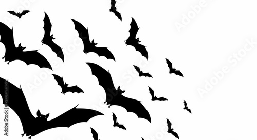 A swarm of black bats flying in a white background, creating a spooky atmosphere.