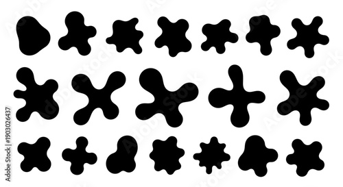 A collection of abstract, irregular black shapes resembling ink blots or amoebas on a white background.