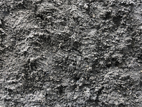 Foto Close-up of rough dark grey concrete wall texture