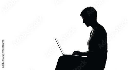 Silhouette of a woman intently focused while typing on a modern portable laptop computer screen