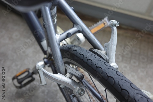 Broken rear V-brake cable on a hybrid bicycle requiring repair