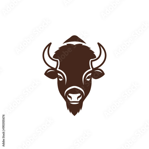 A stylized brown buffalo head with horns and a beard