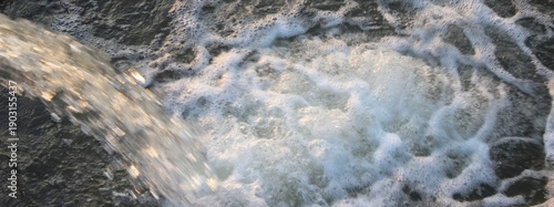 Wallpaper Mural Water stream flowing into a foamy surface Torontodigital.ca