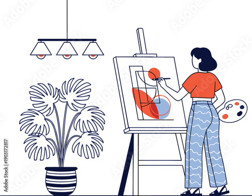 Female artist painting abstract shapes on canvas in home studio with indoor plant and modern lighting.