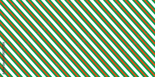 Christmas seamless pattern. Red and green diagonal stripes background. Candy cane repeating decoration wallpaper. Winter holiday lines backdrop. vector,eps.10